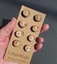 Set of eight small flat driftwood buttons - Image 1