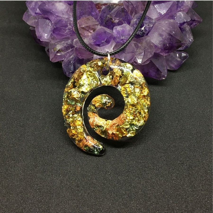 Gold, copper and green metallic swirl large pendant and black cord chain.