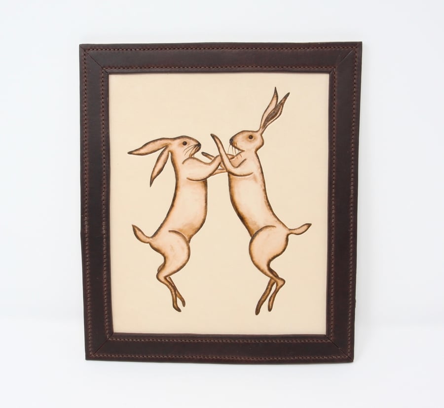 Boxing hares framed leather picture