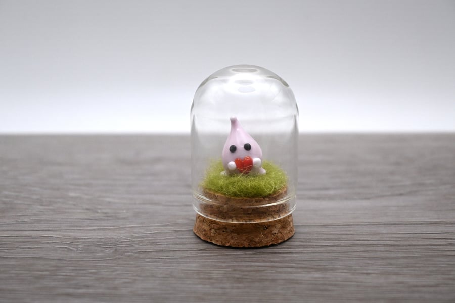 small glass wisp with heart