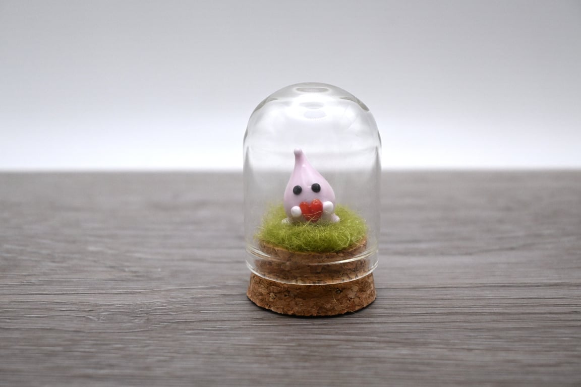small glass wisp with heart