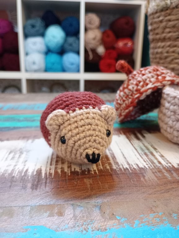 Hedgehog amigurumi in an acorn basket