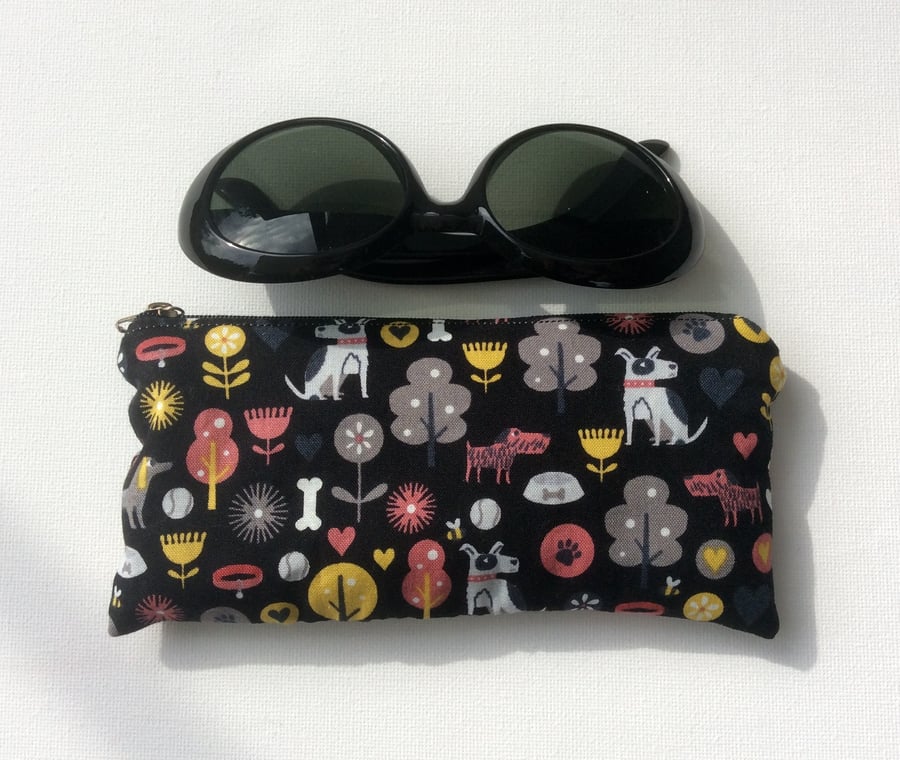Zipped glasses, sunglasses case dogs on black background, small make up bag