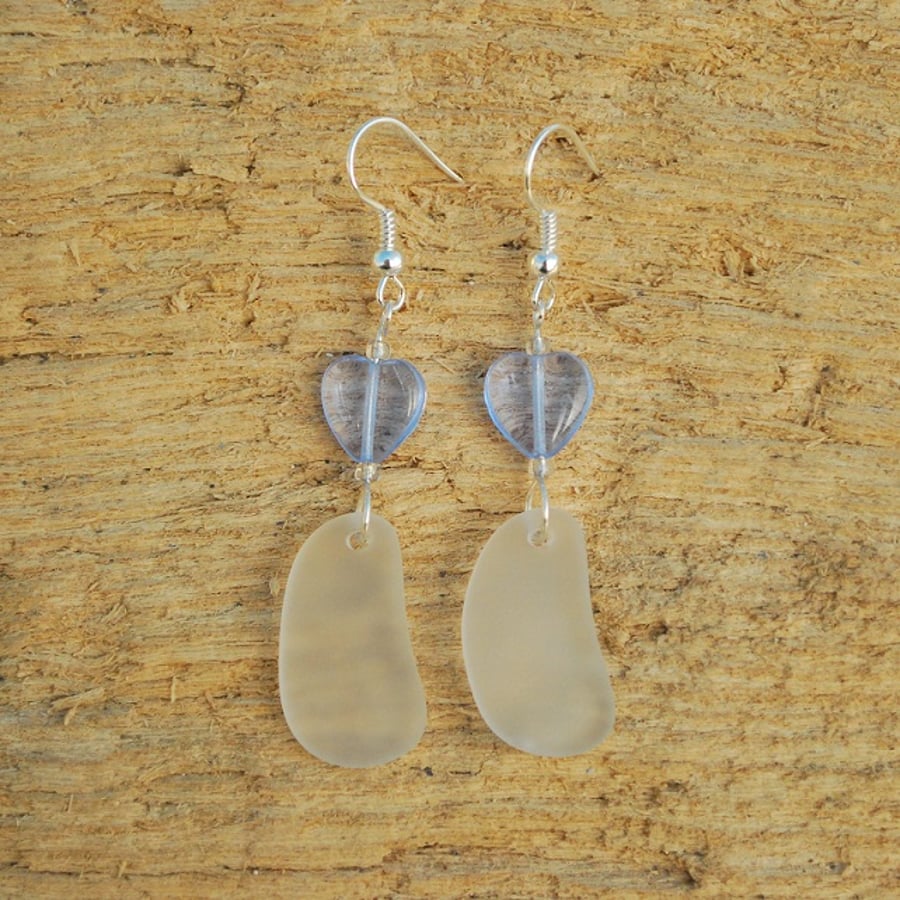 White beach glass earrings with blue hearts