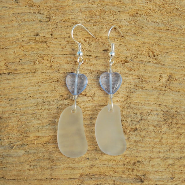 White beach glass earrings with blue hearts