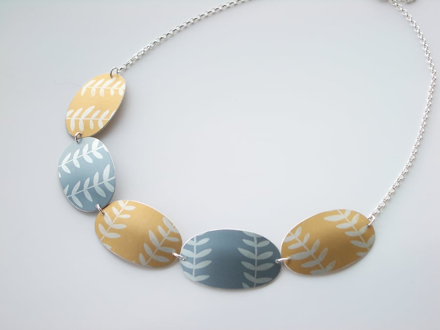 Leaf necklace in yellow and grey