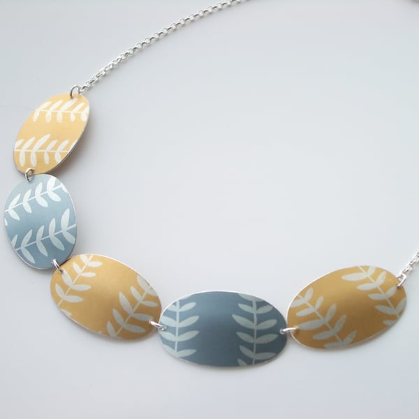 Leaf necklace in yellow and grey