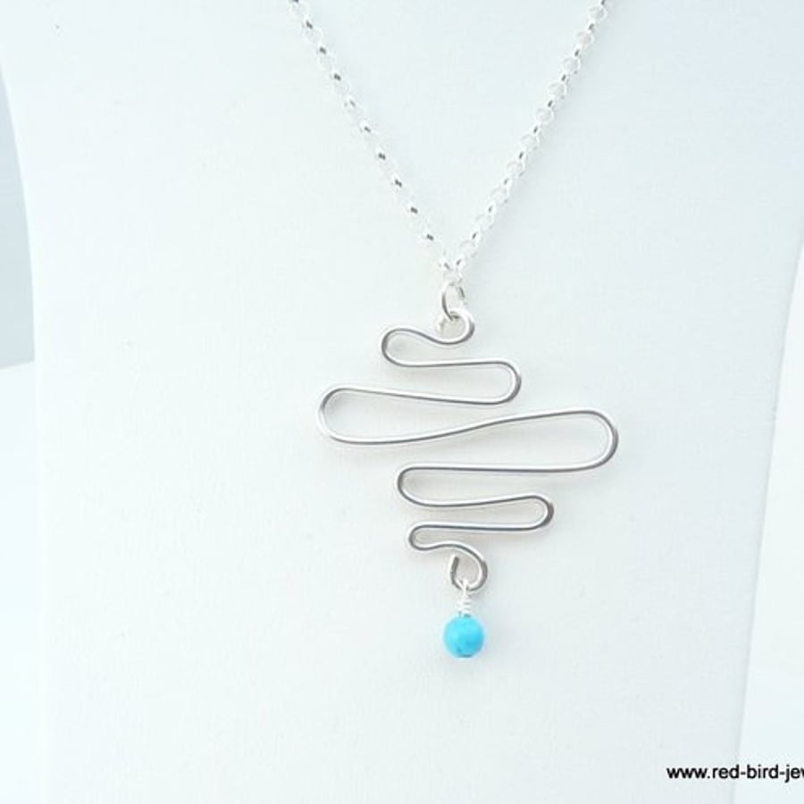 Silver flow pendant with turquoise