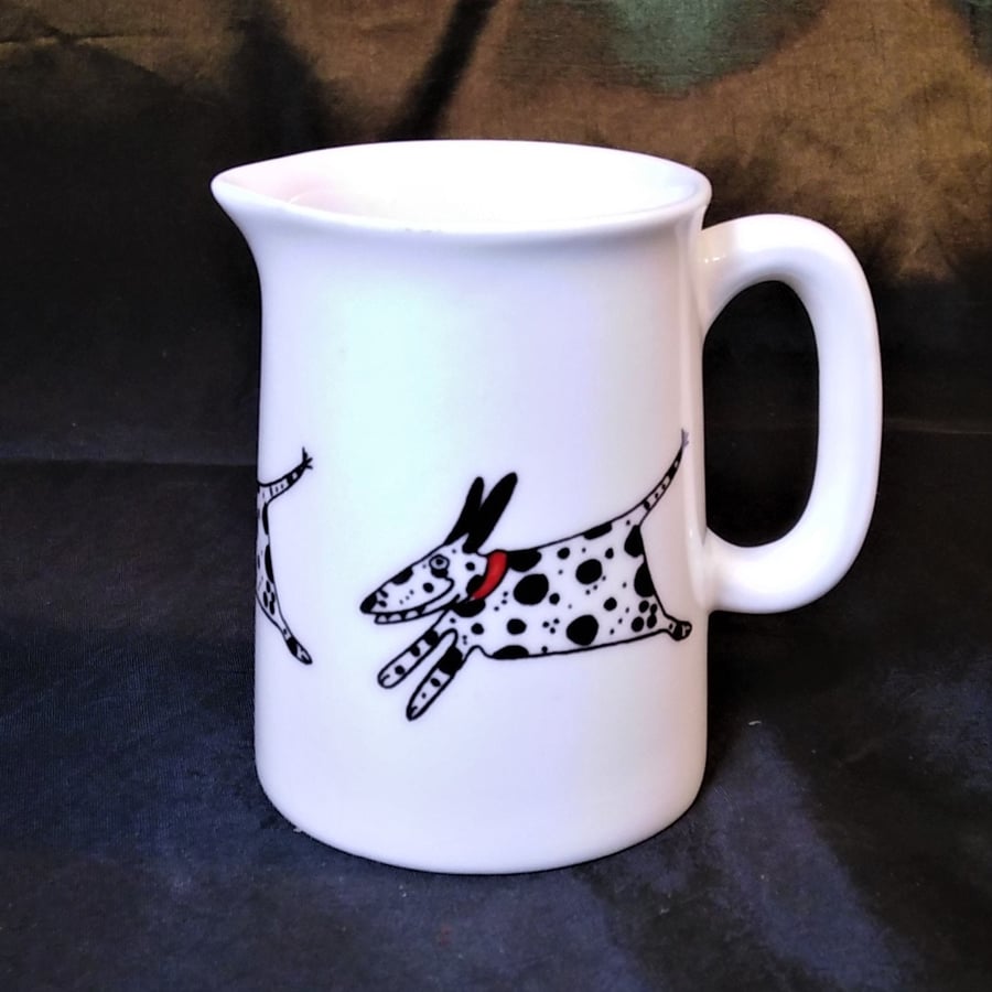 Dalmatian in a red collar on a jug in white bone china with a colourful bird fly