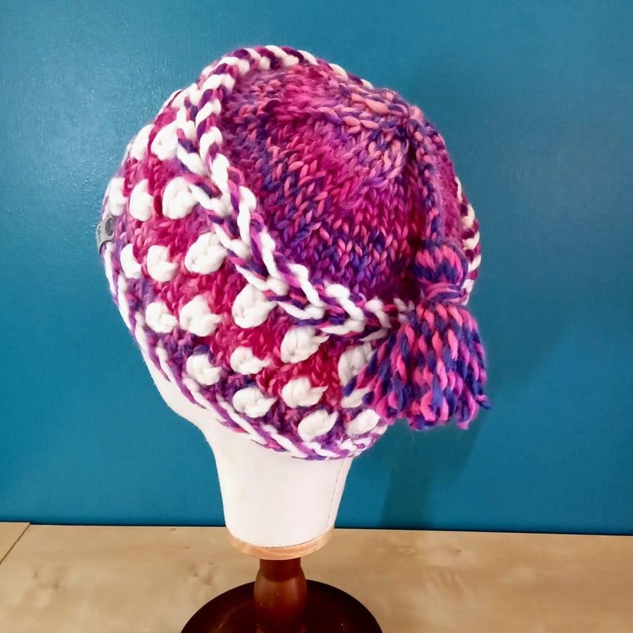 Hand Knit Hat. Super Chunky yarn in pink, purple and white. Removable tassel.