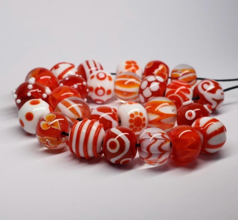Handmade orange and white lamp work glass beads