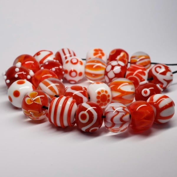 Handmade orange and white lamp work glass beads
