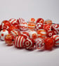 Handmade orange and white lamp work glass beads