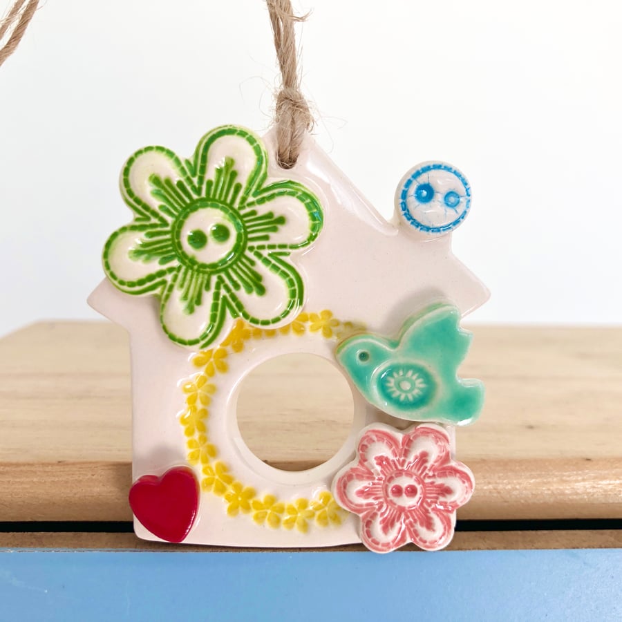 Small Ceramic bird house decoration with pottery bird and button detailing