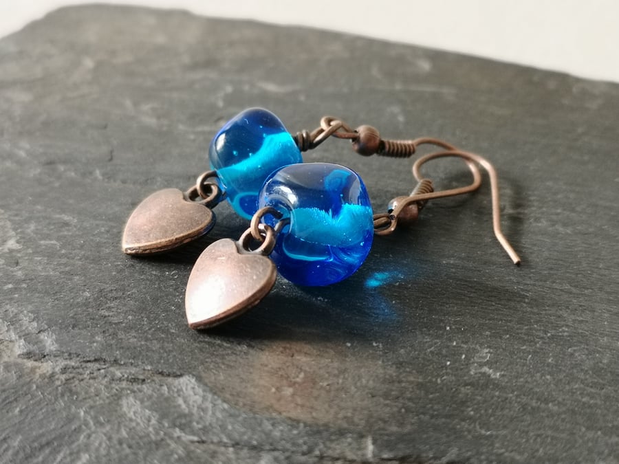 Blue glass bead and copper heart earrings 