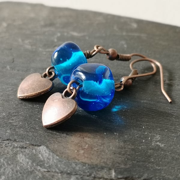 Blue glass bead and copper heart earrings 