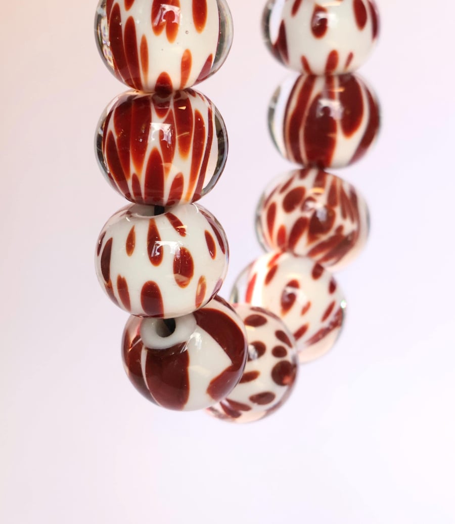 Handmade brown cow print patterned lamp work glass beads