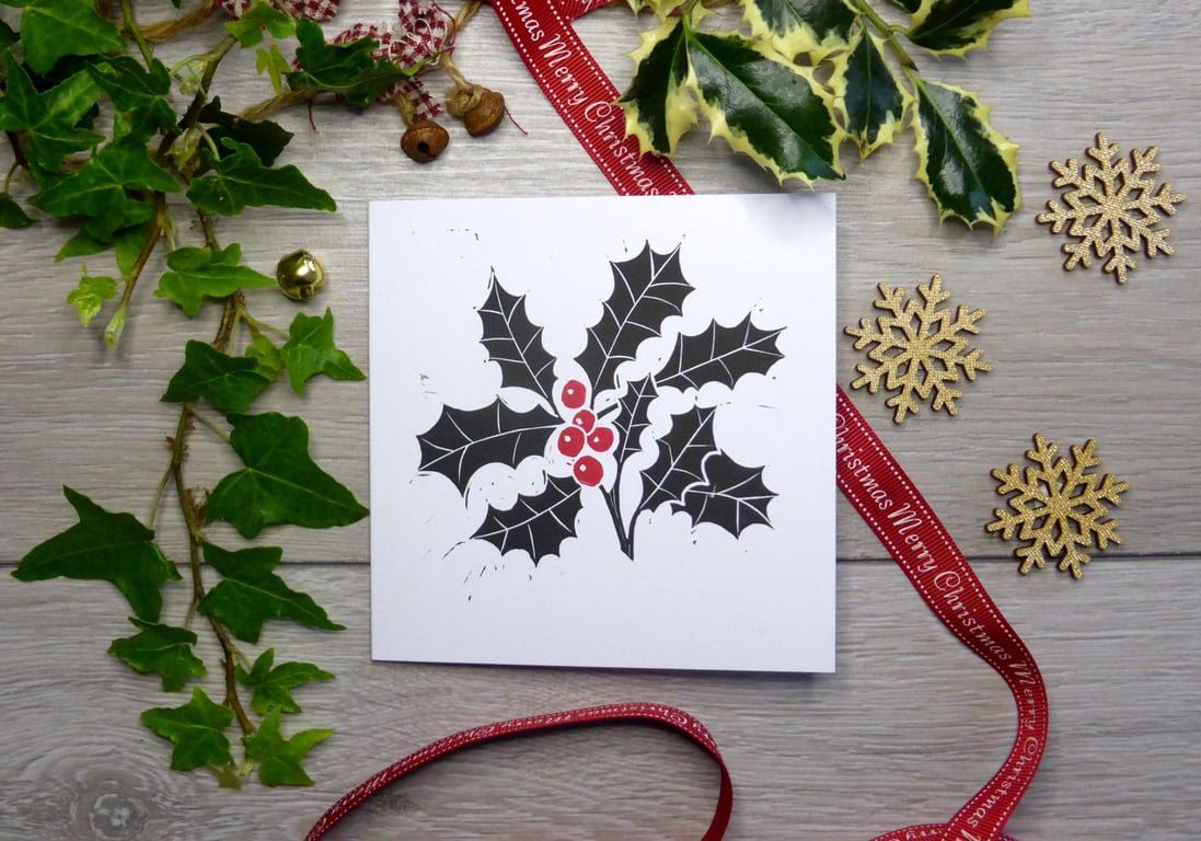 Holly and Berries Christmas card in black and red, handprinted from a linocut