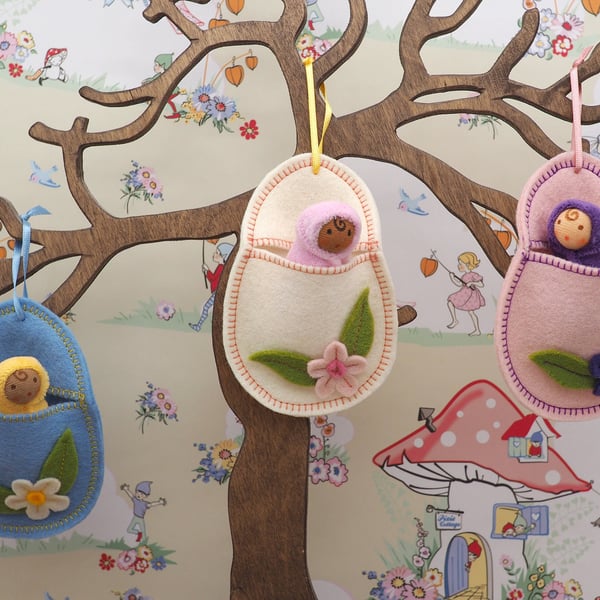 Hanging wool felt Easter egg with a tiny Waldorf doll