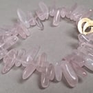 Bracelet from rose quartz chips with brass clasp