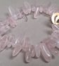 Bracelet from rose quartz chips with brass clasp