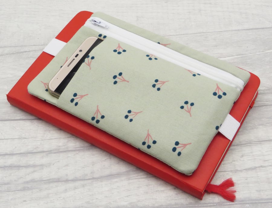 Planner pouch with zipped pocket and band.