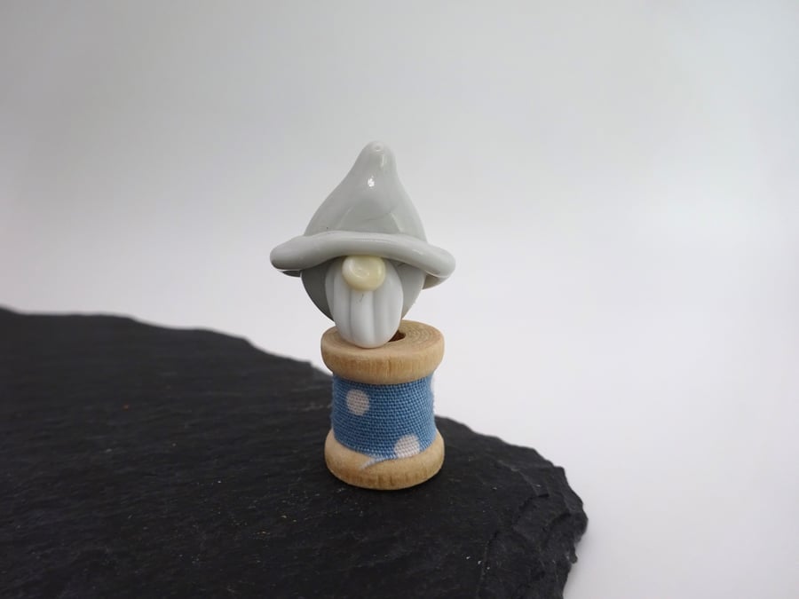 small glass gnome bobbin