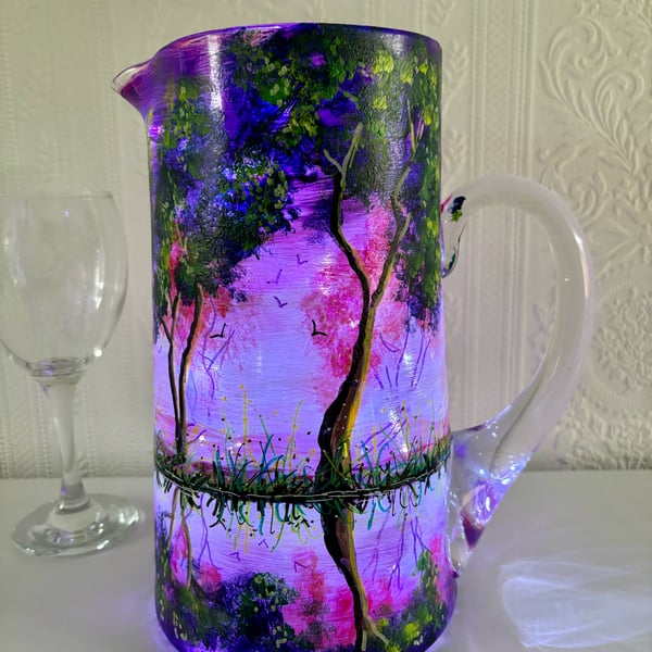 A hand painted and fired glass pitcher by Andrew Jenkins 
