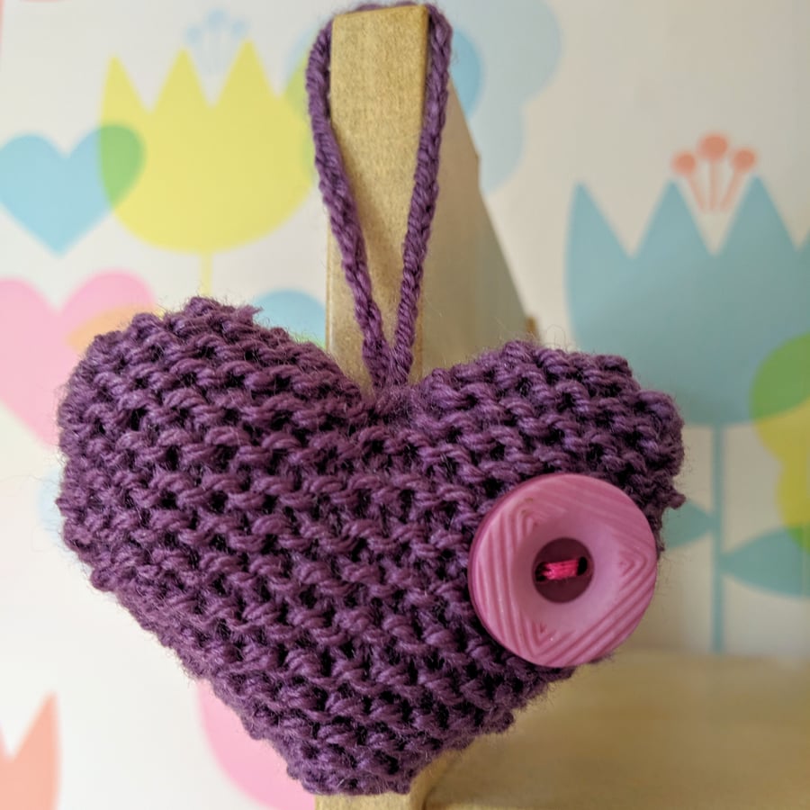 Hand-knitted purple button heart