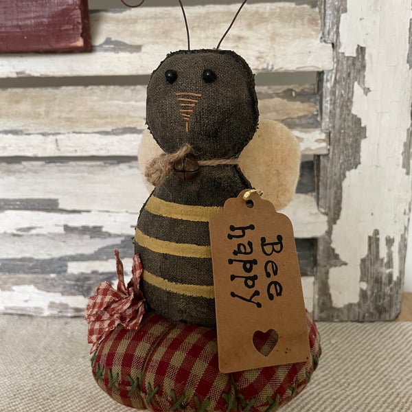 A charming primitive bumble bee pin cushion 