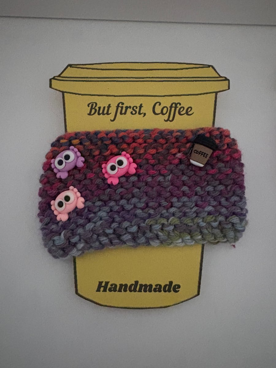 Crab knitted cup cosy. 