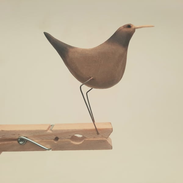 Pecking peg bird