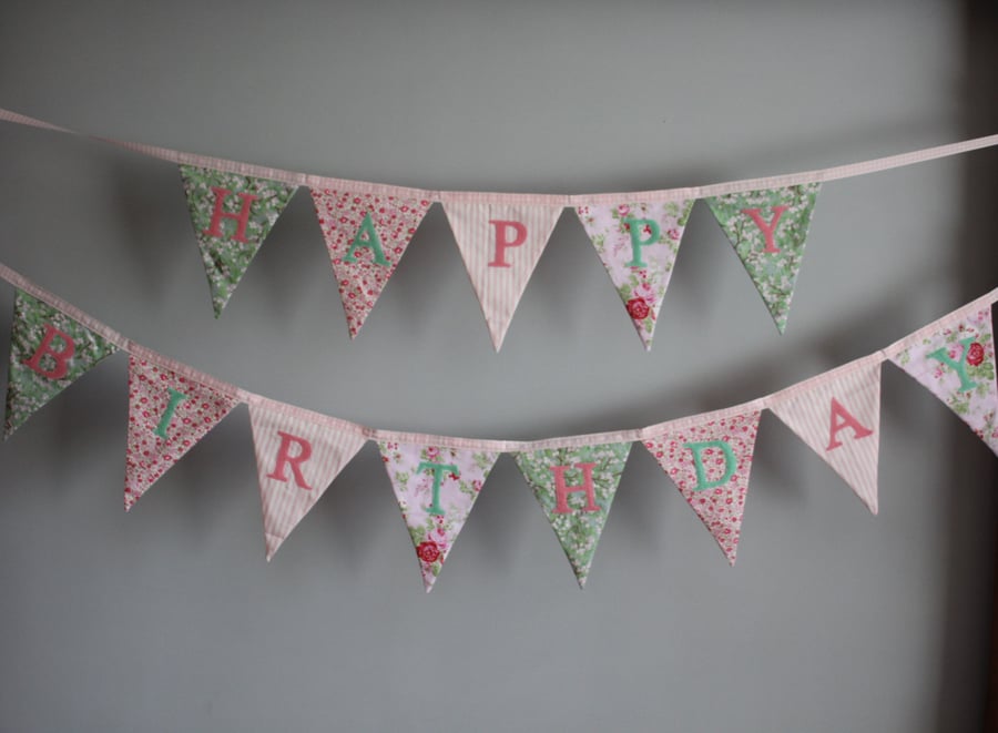'Happy Birthday' bunting in shades of pinks and greens