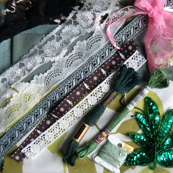 Upcycled slow stitching kit includes fabric, buttons, thread, lace, ribbon