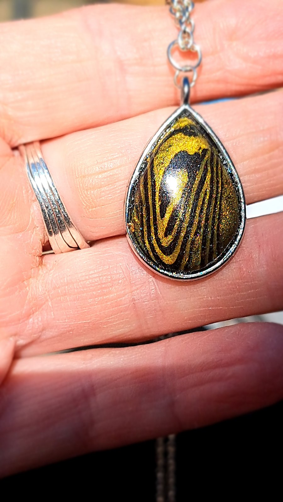 Rope necklace, with a polymer clay filled bezel.. lots of different colours