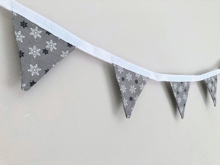 Silver grey with white and black snowflakes Christmas double sided mini bunting.