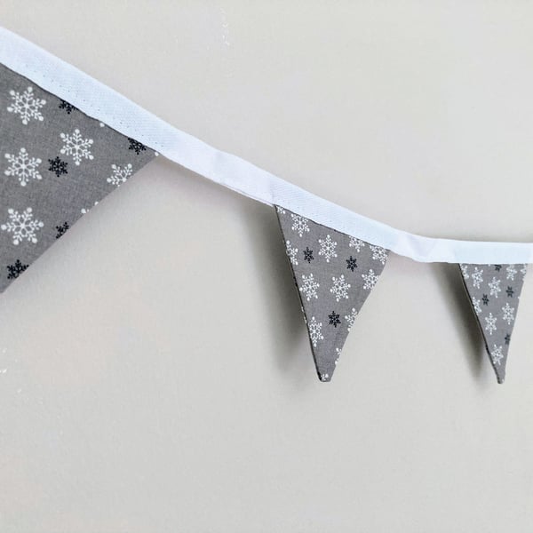 Silver grey with white and black snowflakes Christmas double sided mini bunting.