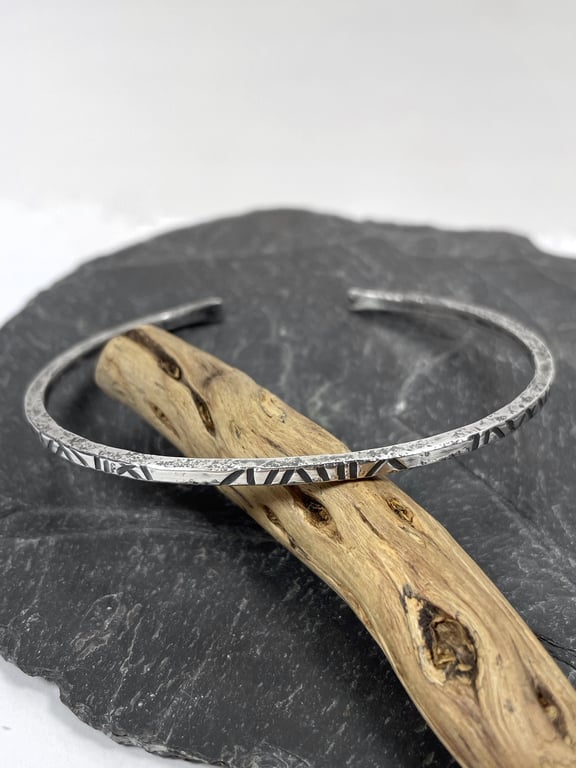Sterling silver open oval bangle with oxidised notched pattern