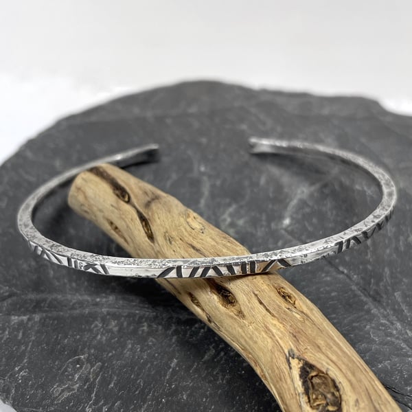 Sterling silver open oval bangle with oxidised notched pattern