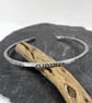 Sterling silver open oval bangle with oxidised notched pattern