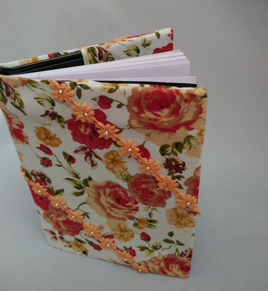 Note Book covered in fabric with lace flowers with beads