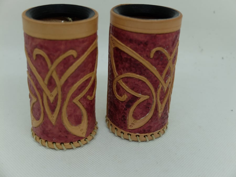 Pair of leather dice cups with a Celtic knot butterfly design