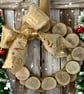 Rustic Christmas Wreath with Natural Wood Slices and Festive Ribbon 