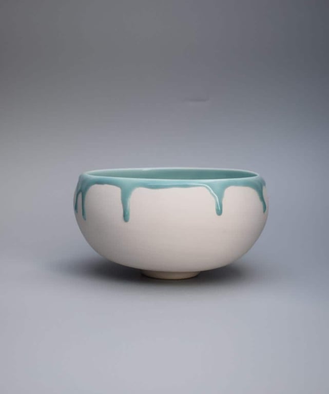 Decorative porcelain bowl with green celadon glaze
