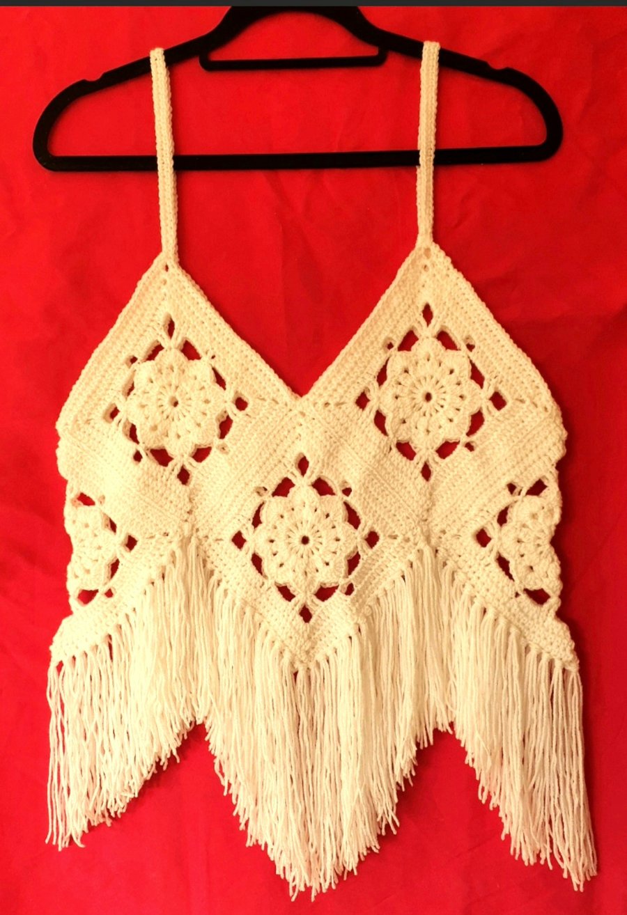 Crocheted strappy vest with Fringing.