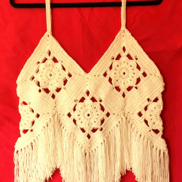 Crocheted strappy vest with Fringing.