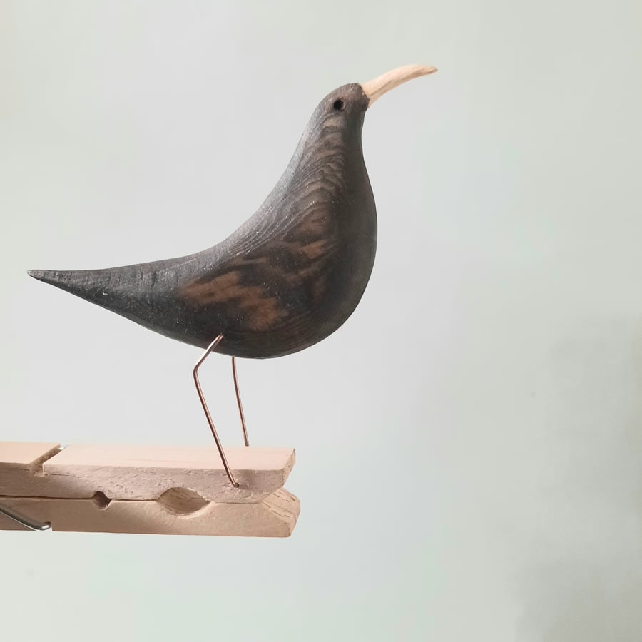 Pecking peg bird