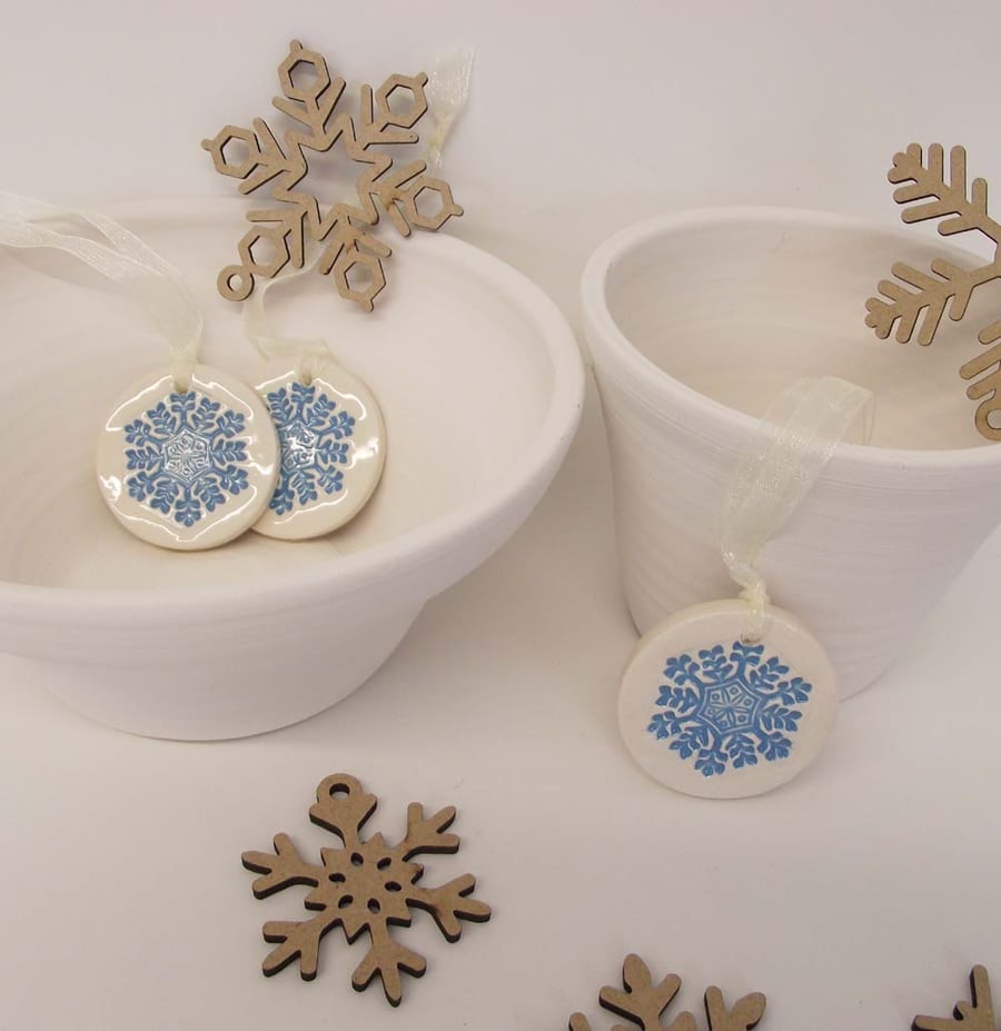 Set of three little blue snowflakes handmade ceramic decorations
