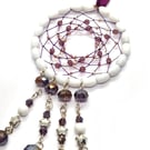 Purple silver and white beaded dreamcatcher