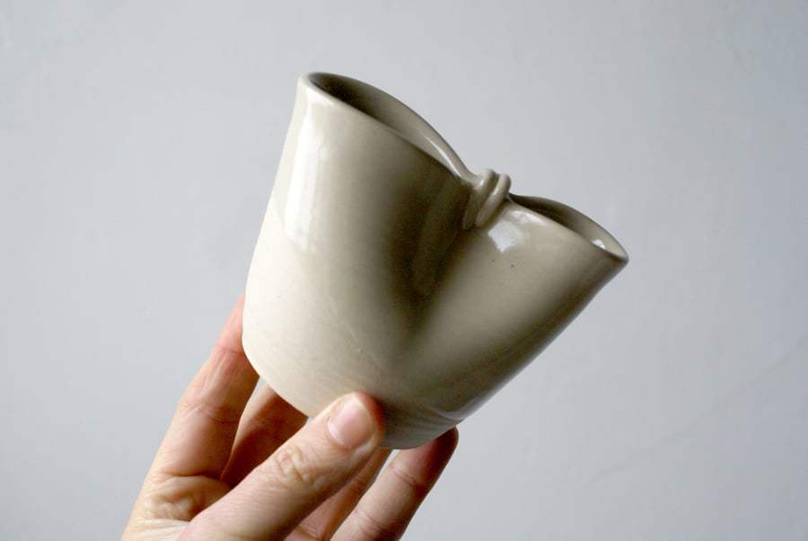 Small handmade folded stoneware pouring jug in simply clay